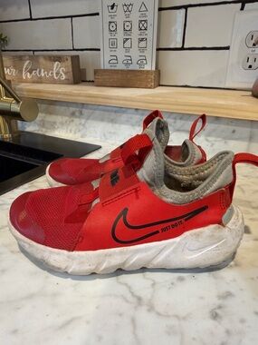 Nike Kids Red and Gray Slip-On Sneakers with Black Swoosh